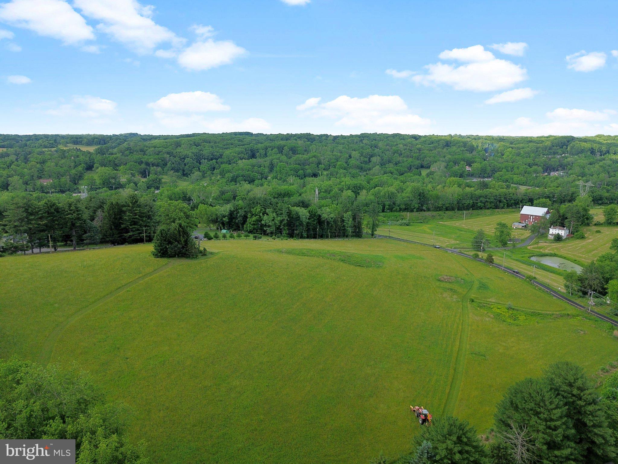 342 Ring Road Chadds Ford, PA 19317 - Photo 73 of 95 Lush green fields under a blue sky.