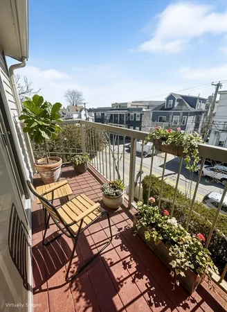 a view of balcony with furniture