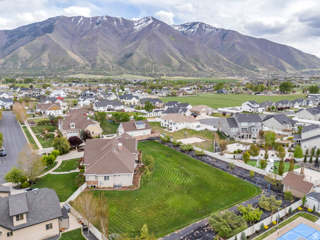 1355 West 1000 South Mapleton, UT 84664 - Photo 62 of 74 Aerial view of property's location featuring nearby suburban area and a mountain backdrop