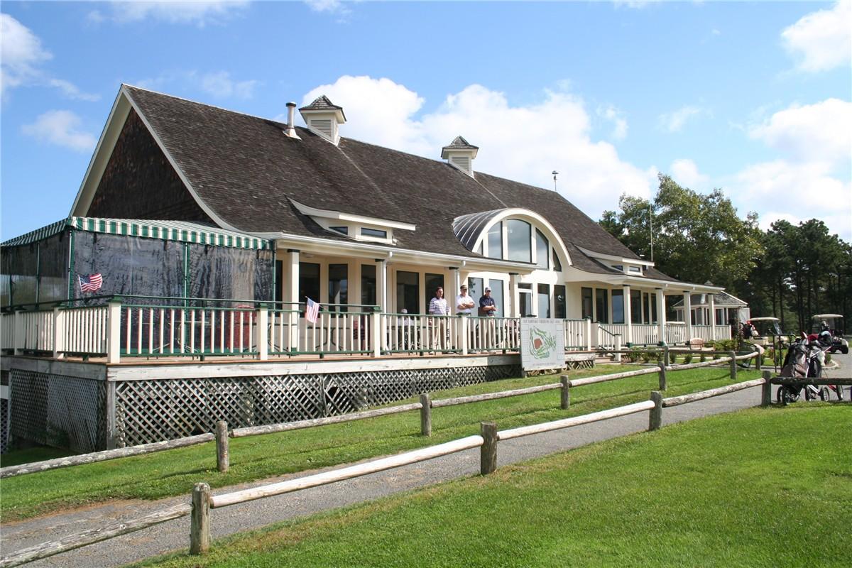 3040 Falmouth Road, Unit F3 Osterville, MA 02655 - Photo 15 of 21 a front view of a house with a yard