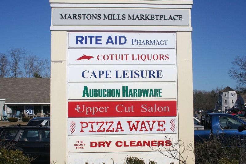 3040 Falmouth Road, Unit F3 Osterville, MA 02655 - Photo 20 of 21 a sign on the side of a building