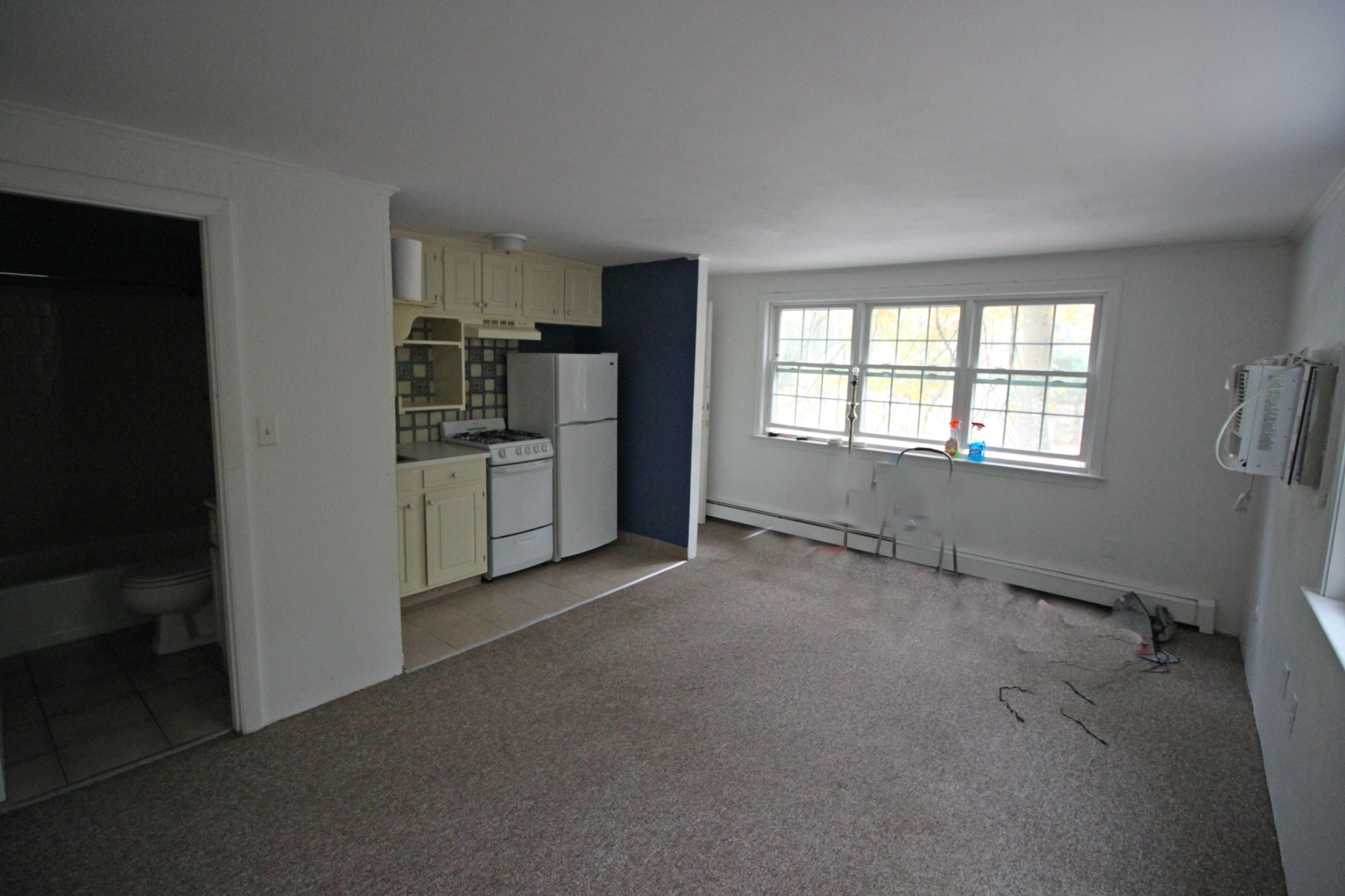 3040 Falmouth Road, Unit F3 Osterville, MA 02655 - Photo 2 of 21 a view of a kitchen with refrigerator stove and cabinets