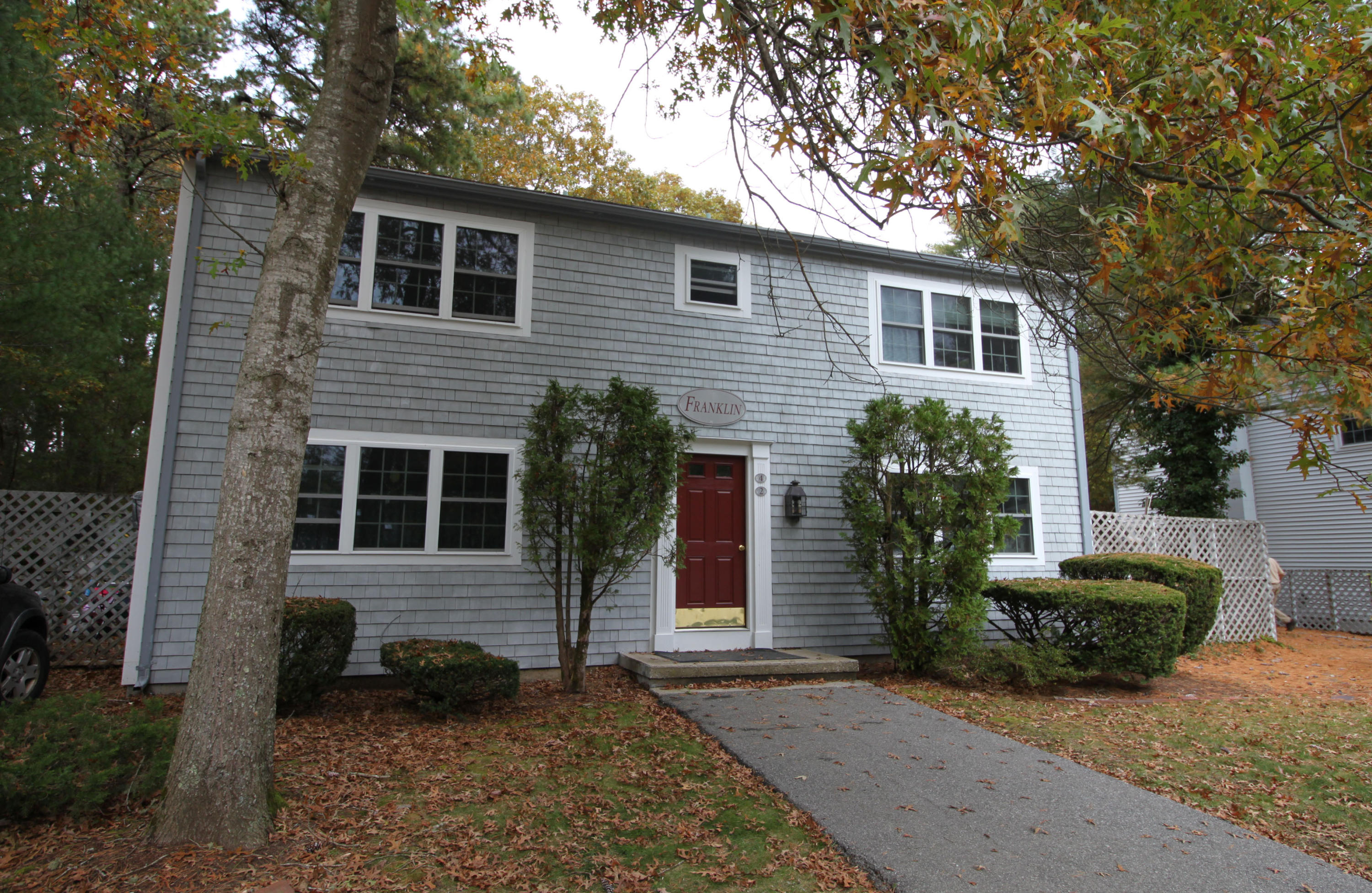 3040 Falmouth Road, Unit F3 Osterville, MA 02655 - Photo 3 of 21 a view of a house with a yard