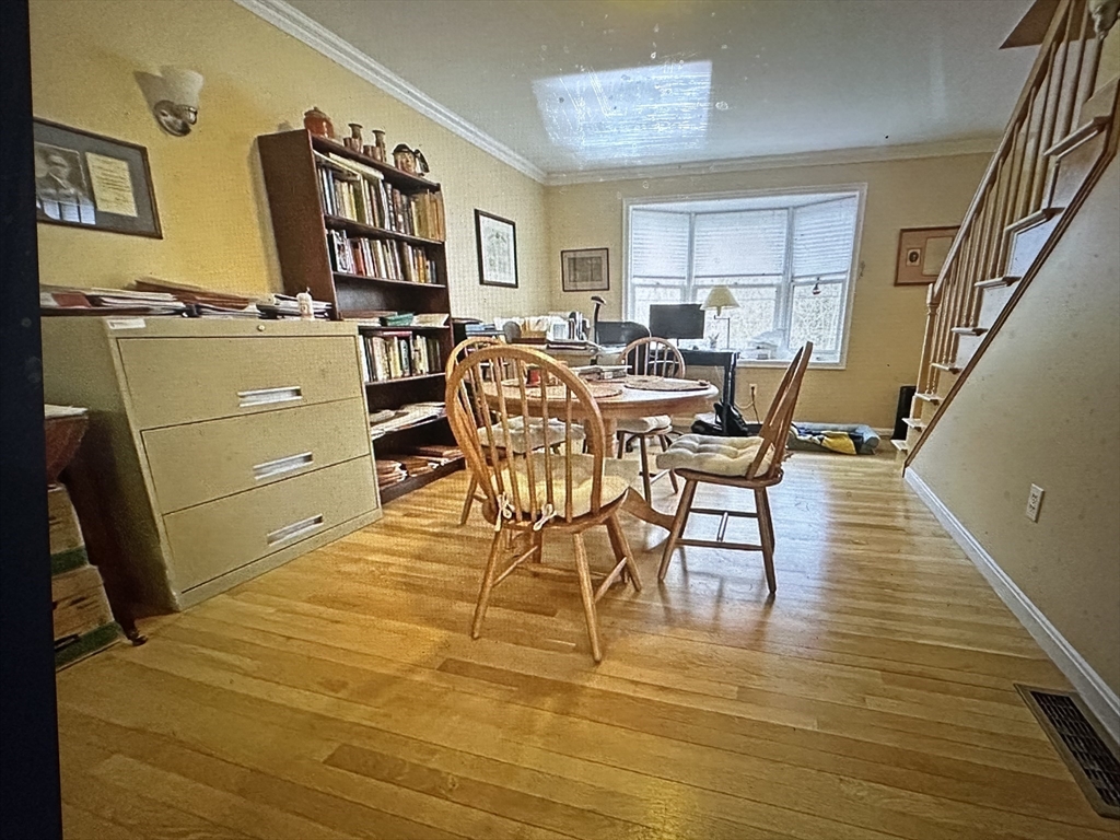 21 Hamlet Street, Unit 21 Newton, MA 02459 - Photo 15 of 15 a view of a dining room with furniture and a kitchen