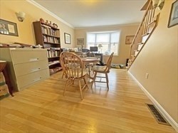21 Hamlet Street, Unit 21 Newton, MA 02459 - Photo 6 of 15 a dining room with furniture and wooden floor