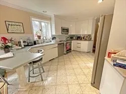 a kitchen with a sink cabinets and window