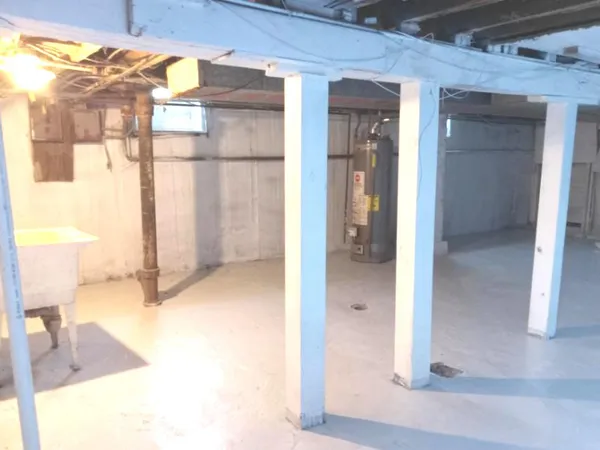 a view of a bathroom with a tub and shower