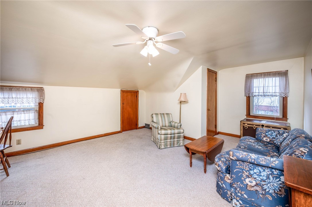 253 Butler Road Northeast Warren, OH 44483 - Photo 27 of 35 Bedroom with light carpet, ceiling fan, and lofted ceiling