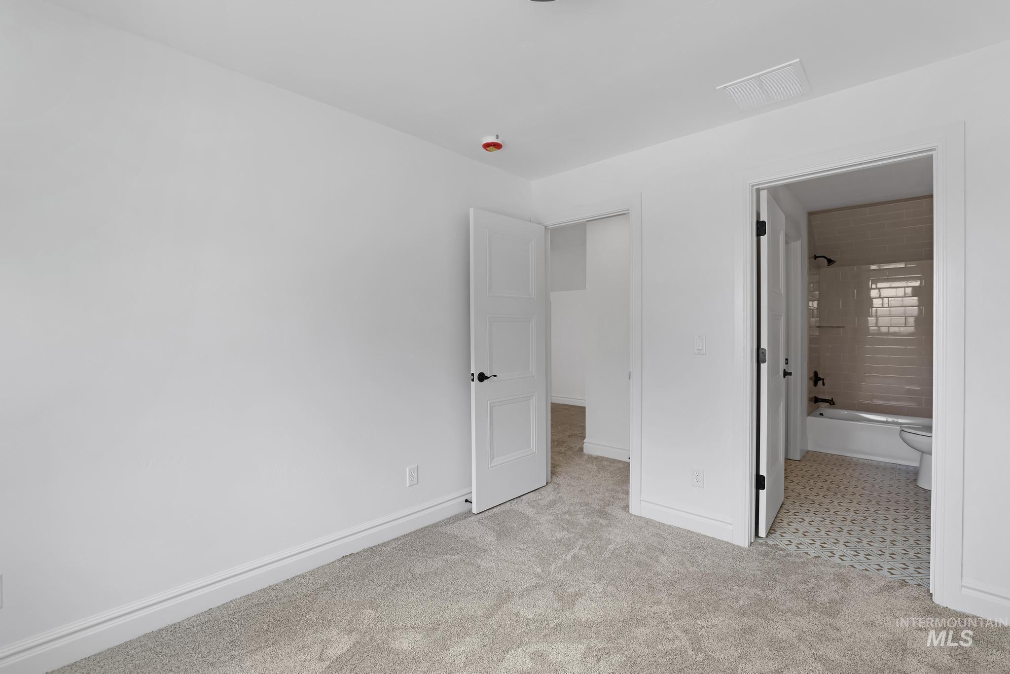 866 Quartz Road Kimberly, ID 83341 - Photo 33 of 48 Bedroom featuring light-toned carpet flooring and clean white walls
