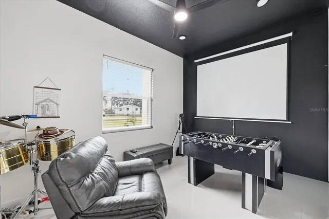 a living room with furniture a rug and a window