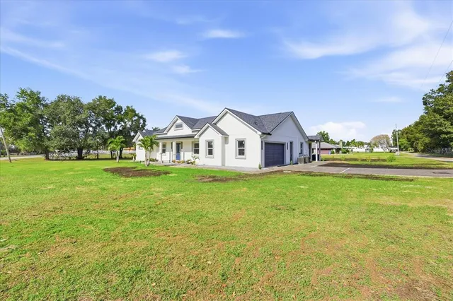 a view of a house with a big yard