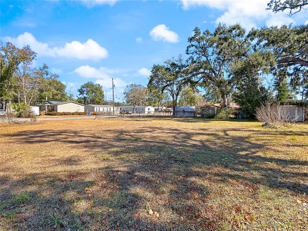 a swimming pool with an outdoor space and seating area