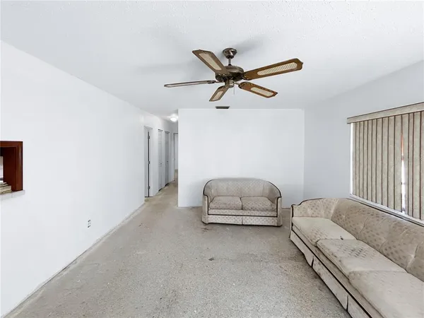 a living room with furniture and windows