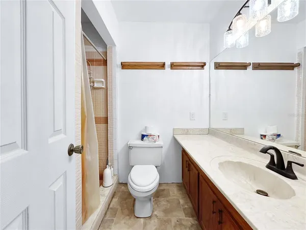 an empty room with a bathroom