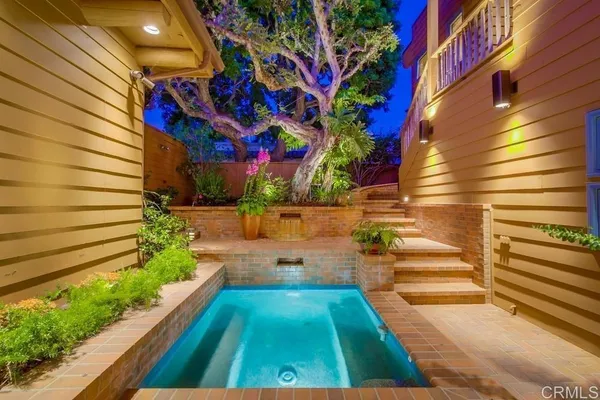 a kitchen with stainless steel appliances granite countertop a refrigerator and a stove