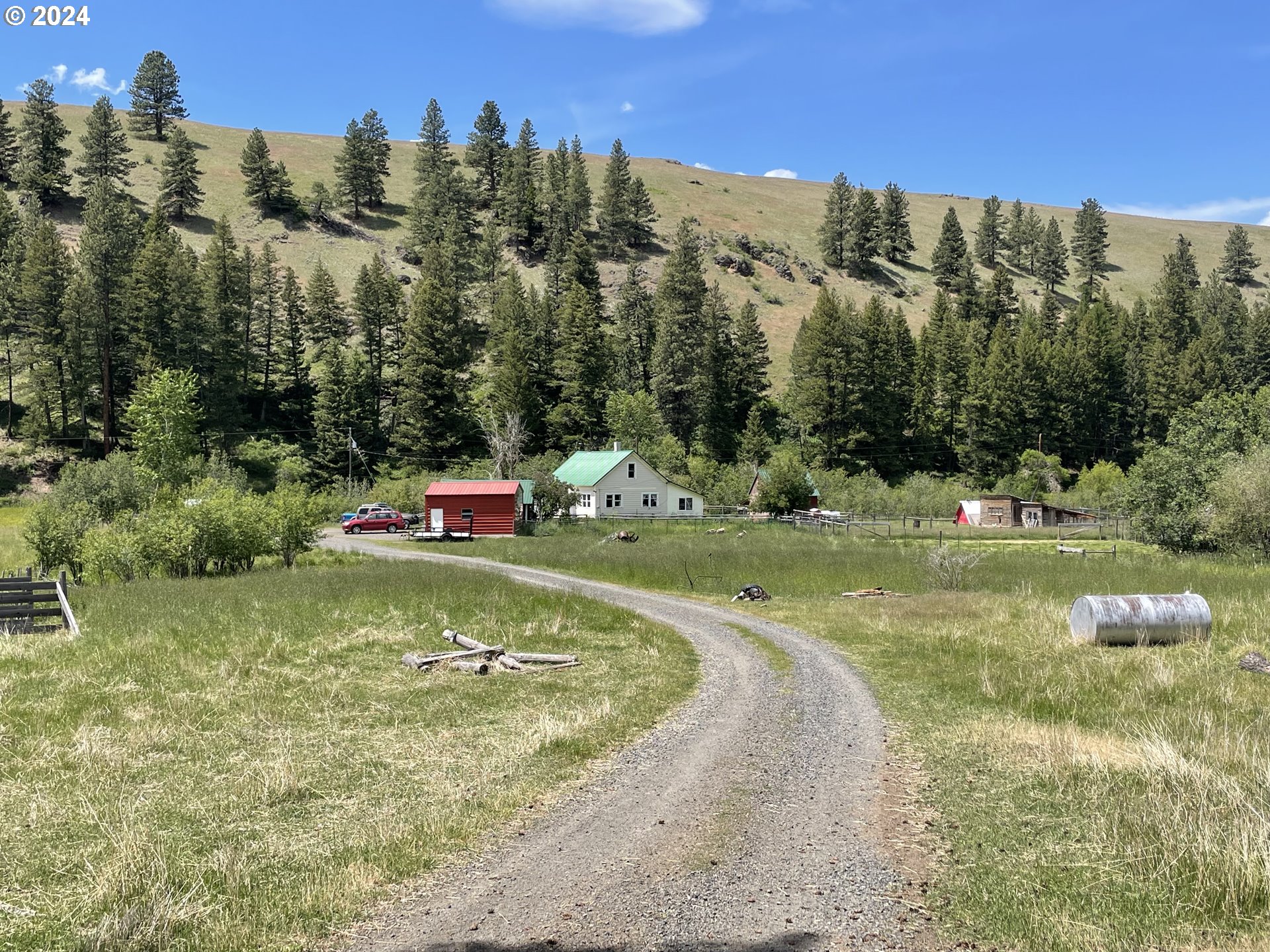 62254 Wallowa Mtn Loop Road Joseph, OR 97846 - Photo 1 of 35 a swimming pool with trees in the background