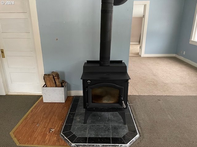62254 Wallowa Mtn Loop Road Joseph, OR 97846 - Photo 29 of 35 a living room with furniture and a fireplace