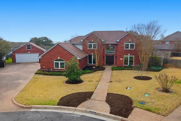 a front view of a house with yard
