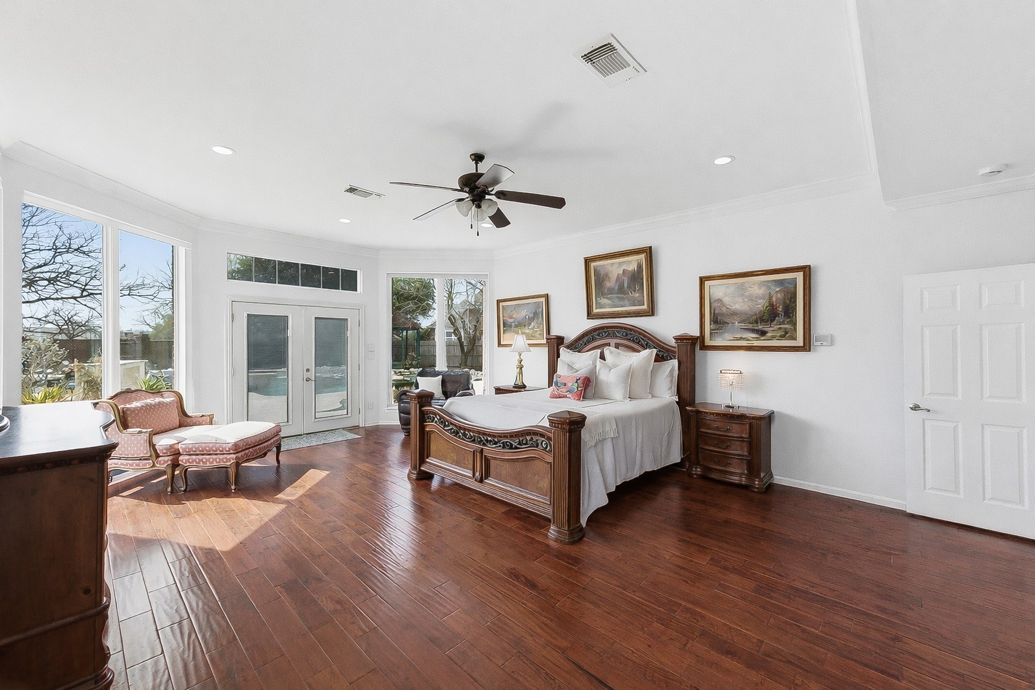 5705 Ballenton Court Austin, TX 78739 - Photo 11 of 30 a spacious bedroom with a bed and a large window