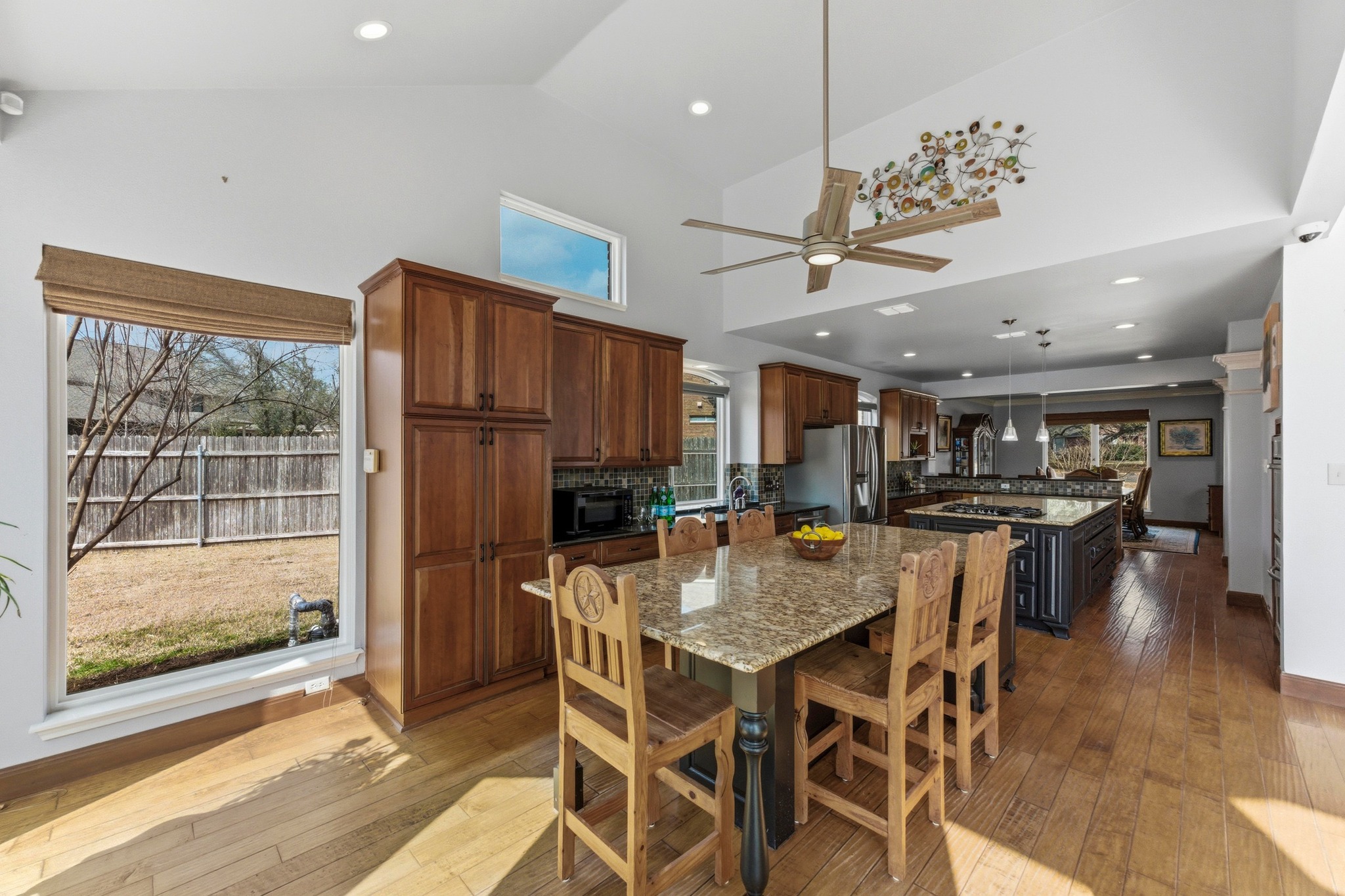 5705 Ballenton Court Austin, TX 78739 - Photo 16 of 30 a view of a dining room with furniture window and wooden floor