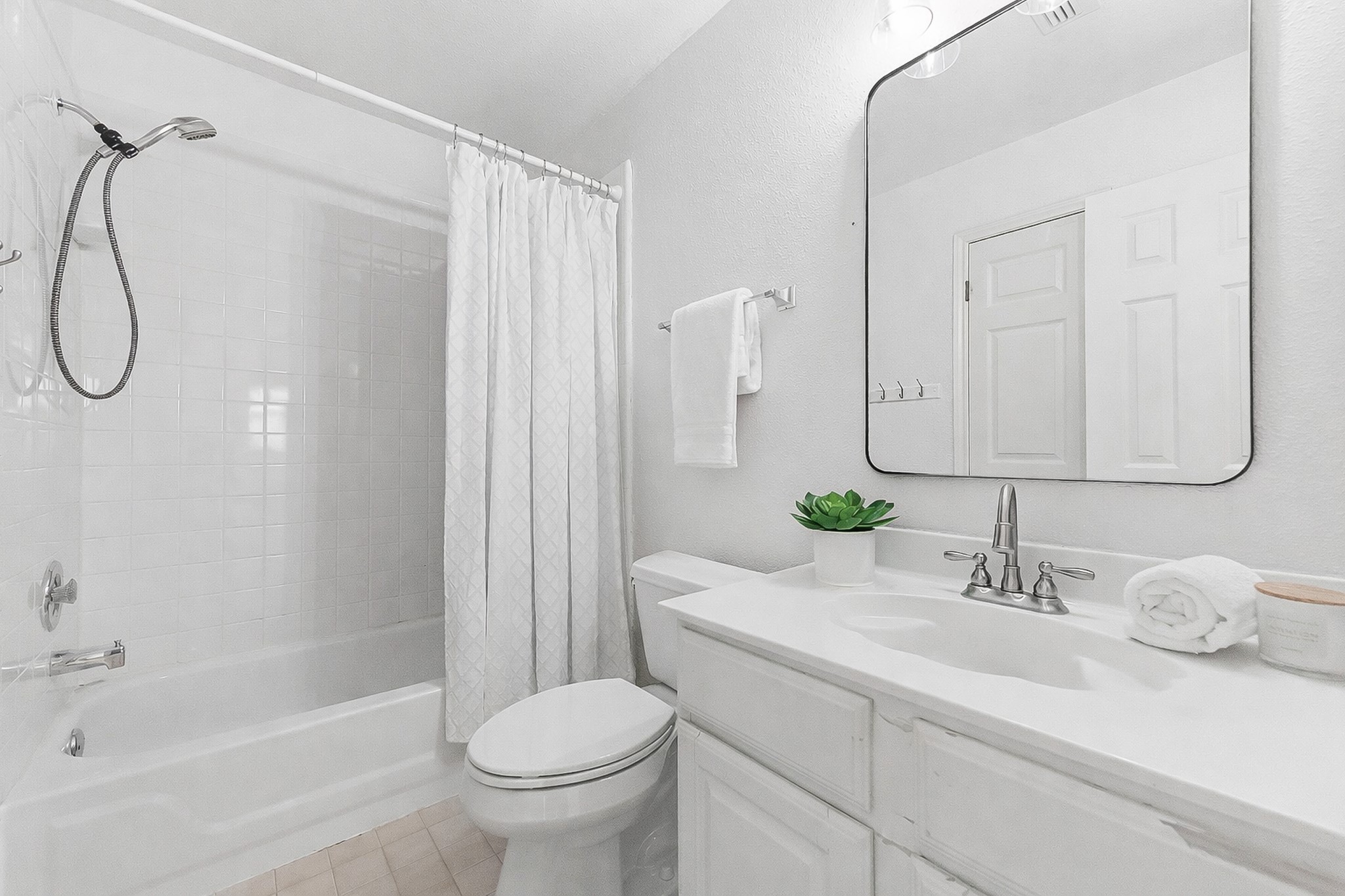 5705 Ballenton Court Austin, TX 78739 - Photo 19 of 30 a bathroom with a sink a toilet and shower