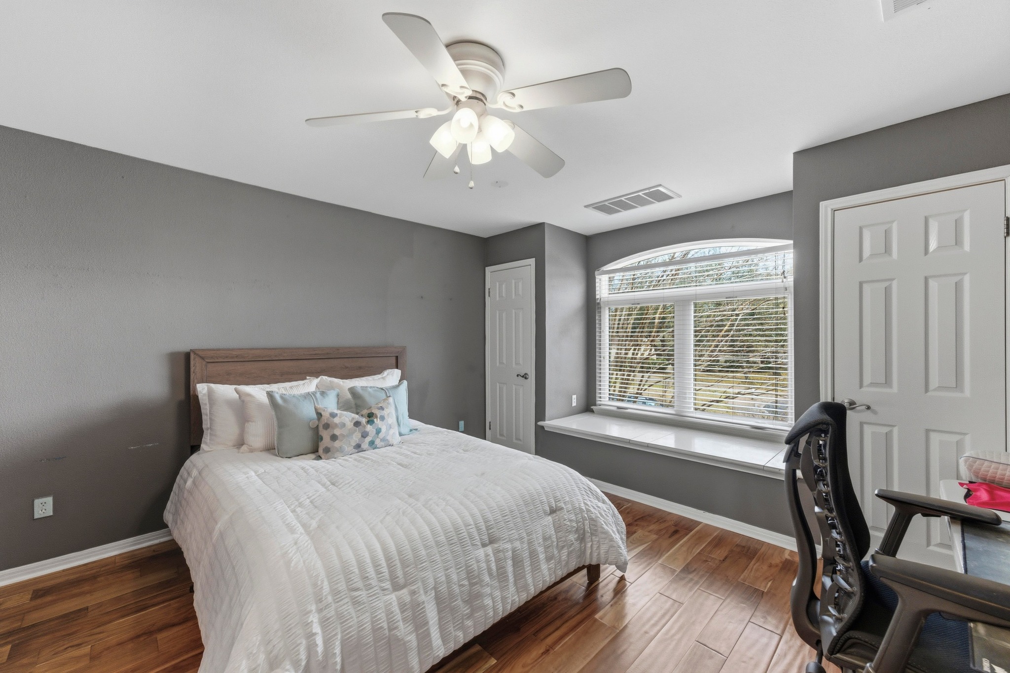 5705 Ballenton Court Austin, TX 78739 - Photo 23 of 30 a bedroom with a large bed and a large window