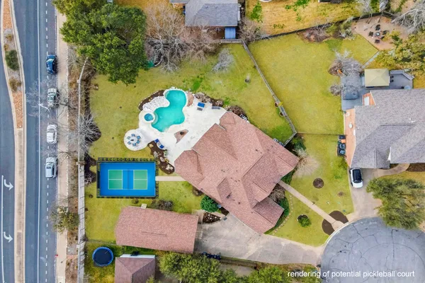 an aerial view of a house with a swimming pool