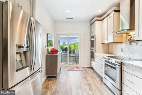 a bedroom with a bed and a lamp on table