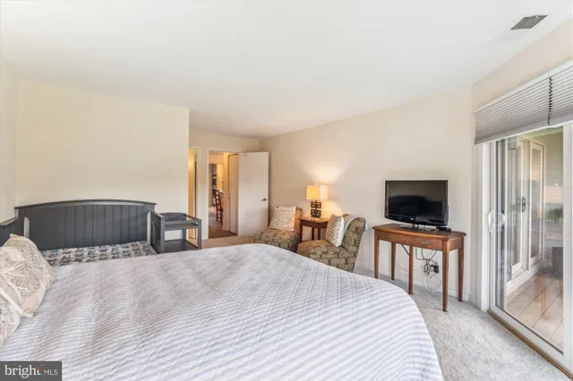a bathroom with a sink vanity mirror and toilet