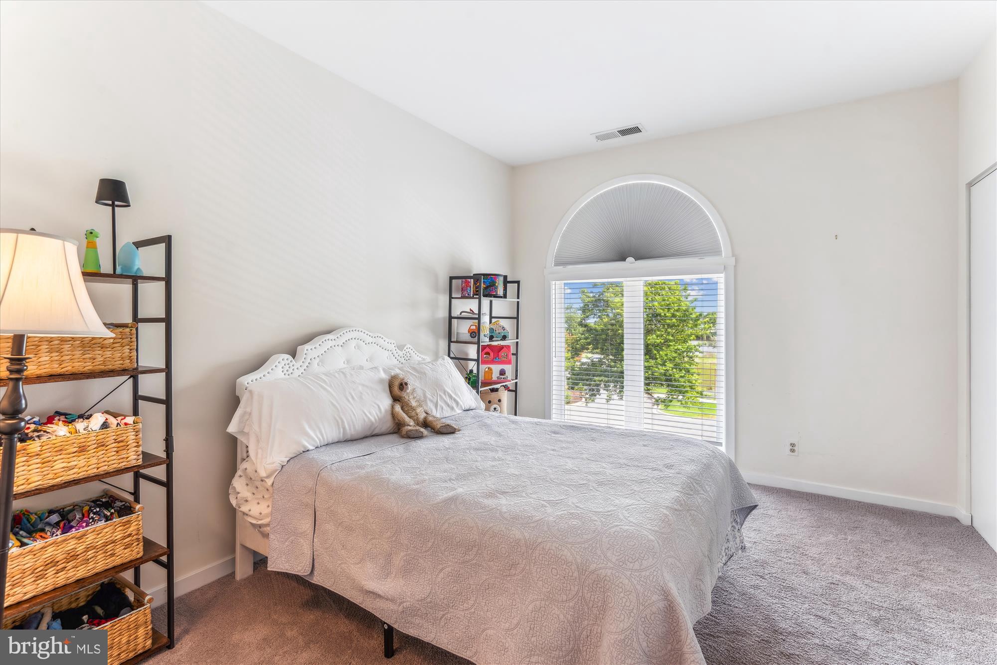 2108 Chesapeake Harbour Drive East, Unit 201 Annapolis, MD 21403 - Photo 28 of 82 a bedroom with a bed and a window