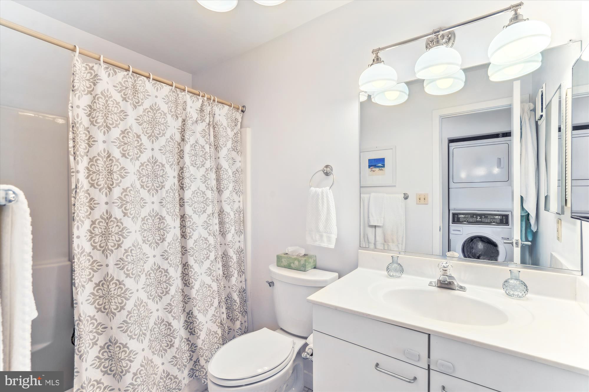 2108 Chesapeake Harbour Drive East, Unit 201 Annapolis, MD 21403 - Photo 32 of 82 a bathroom with a sink vanity mirror and toilet