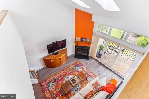 a front view of a house with a garden and street view