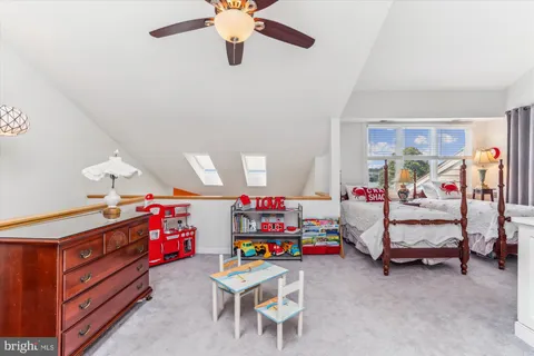 a view of a lake with boats and trees in the background