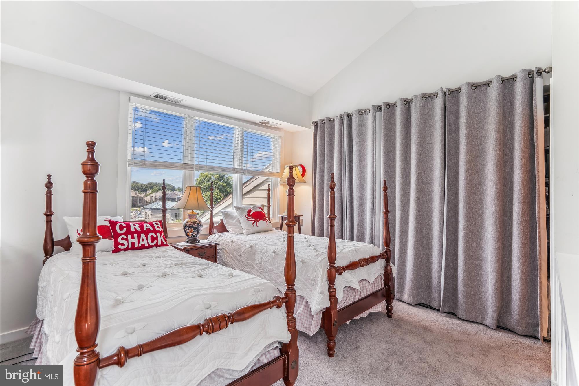 2108 Chesapeake Harbour Drive East, Unit 201 Annapolis, MD 21403 - Photo 42 of 82 a bedroom with a bed and a large window