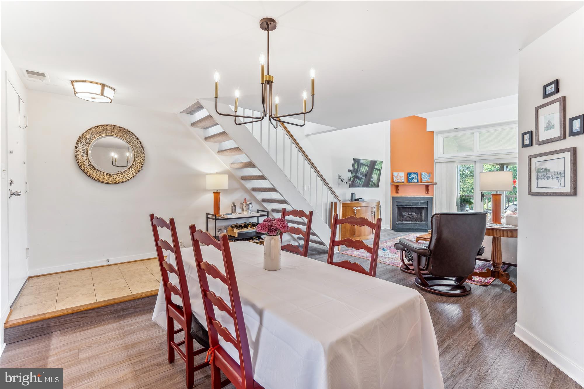 2108 Chesapeake Harbour Drive East, Unit 201 Annapolis, MD 21403 - Photo 6 of 82 a view of a dining room and livingroom with furniture wooden floor clock and a chandelier