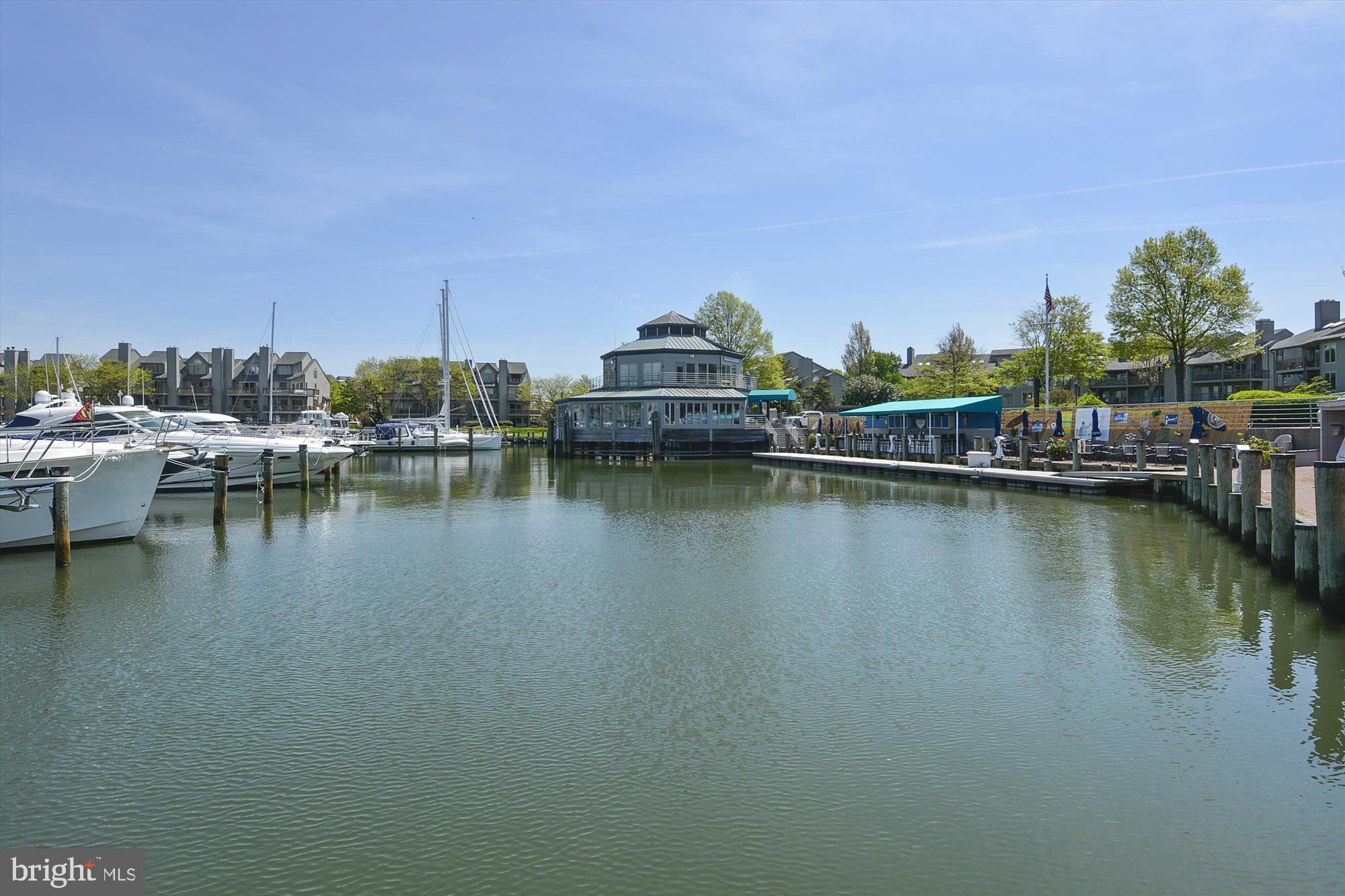 2108 Chesapeake Harbour Drive East, Unit 201 Annapolis, MD 21403 - Photo 61 of 82 a view of a lake with boats and trees in the background