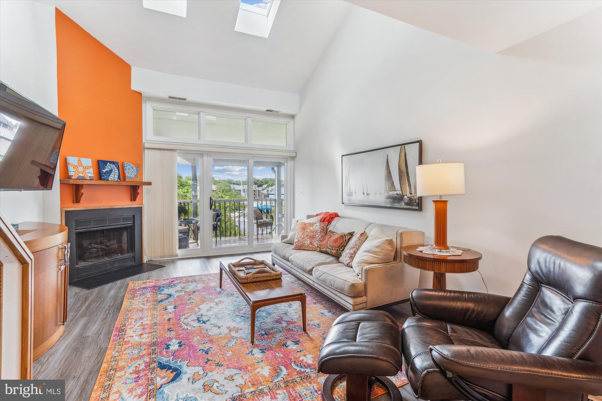 2108 Chesapeake Harbour Drive East, Unit 201 Annapolis, MD 21403 - Photo 7 of 82 a living room with furniture fireplace and a table
