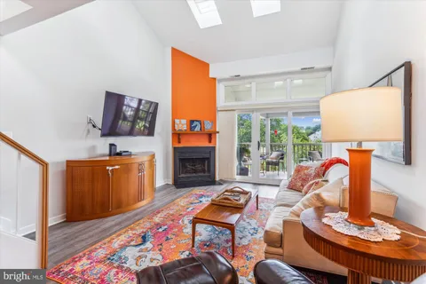 a view of a swimming pool with an outdoor seating and a yard