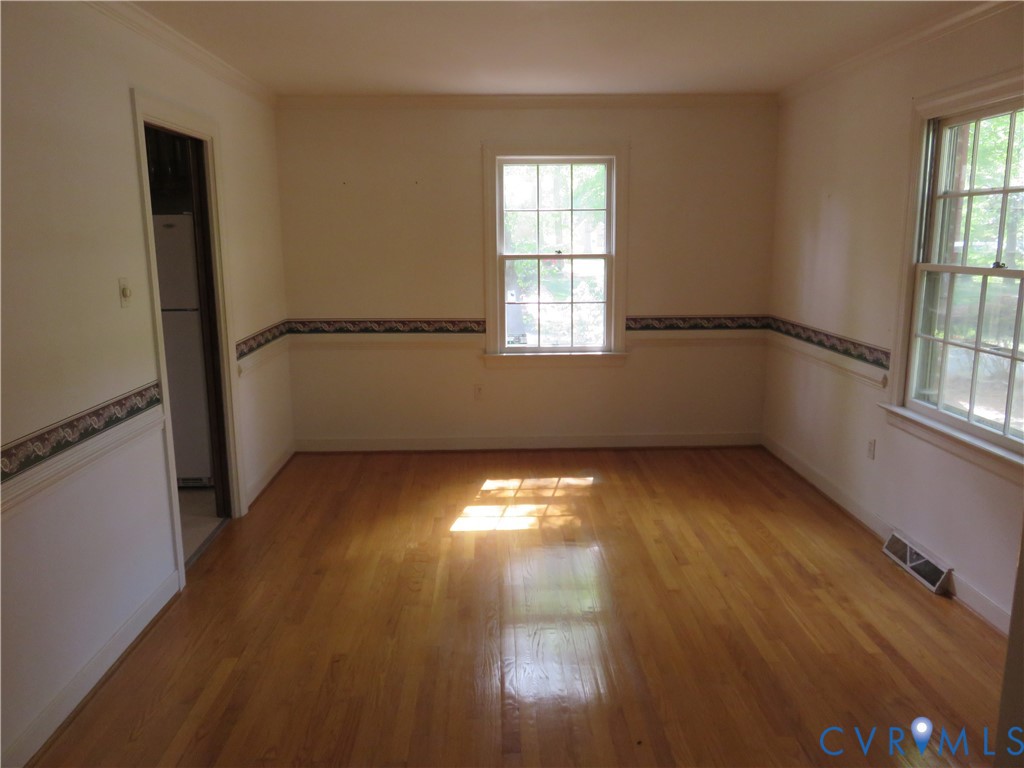 8379 Quailfield Road Mechanicsville, VA 23116 - Photo 18 of 56 wooden floor in an empty room with a window