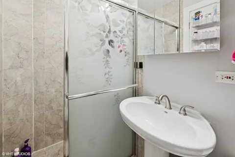a bathroom with a sink and mirror