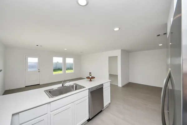 a kitchen with a sink and cabinets