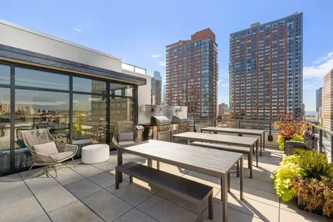 a swimming pool with outdoor seating