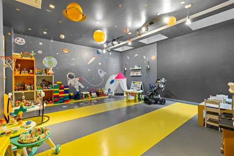 a dining room with furniture and wooden floor