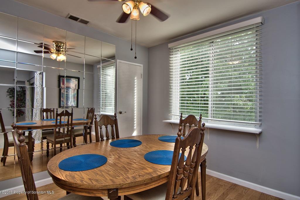 1211 Summit Pointe Scranton, PA 18508 - Photo 11 of 33 a view of a dining room with furniture window and wooden floor