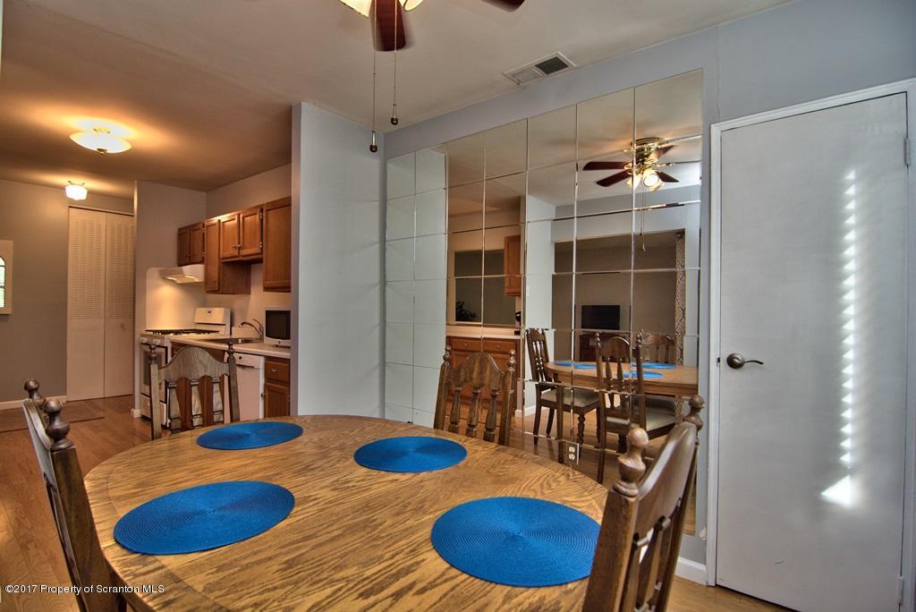 1211 Summit Pointe Scranton, PA 18508 - Photo 13 of 33 a view of a dining room with furniture and wooden floor