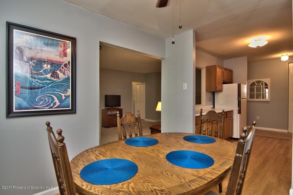 1211 Summit Pointe Scranton, PA 18508 - Photo 14 of 33 a dining room with furniture and wooden floor