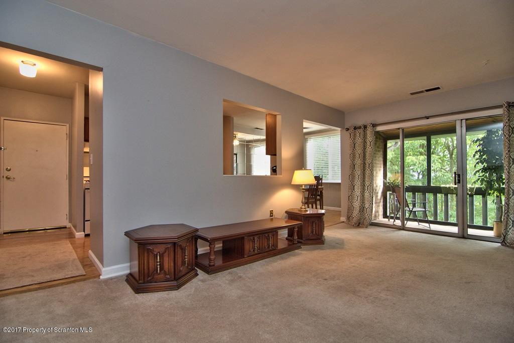 1211 Summit Pointe Scranton, PA 18508 - Photo 16 of 33 a spacious bedroom with a bed and a large window