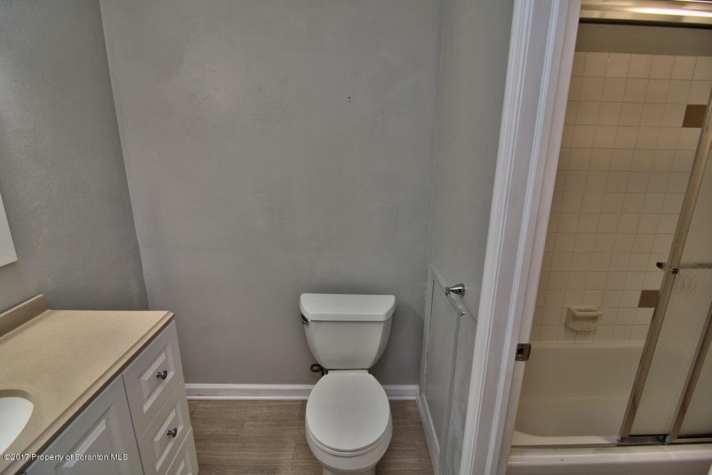 1211 Summit Pointe Scranton, PA 18508 - Photo 26 of 33 a bathroom with a toilet and a mirror