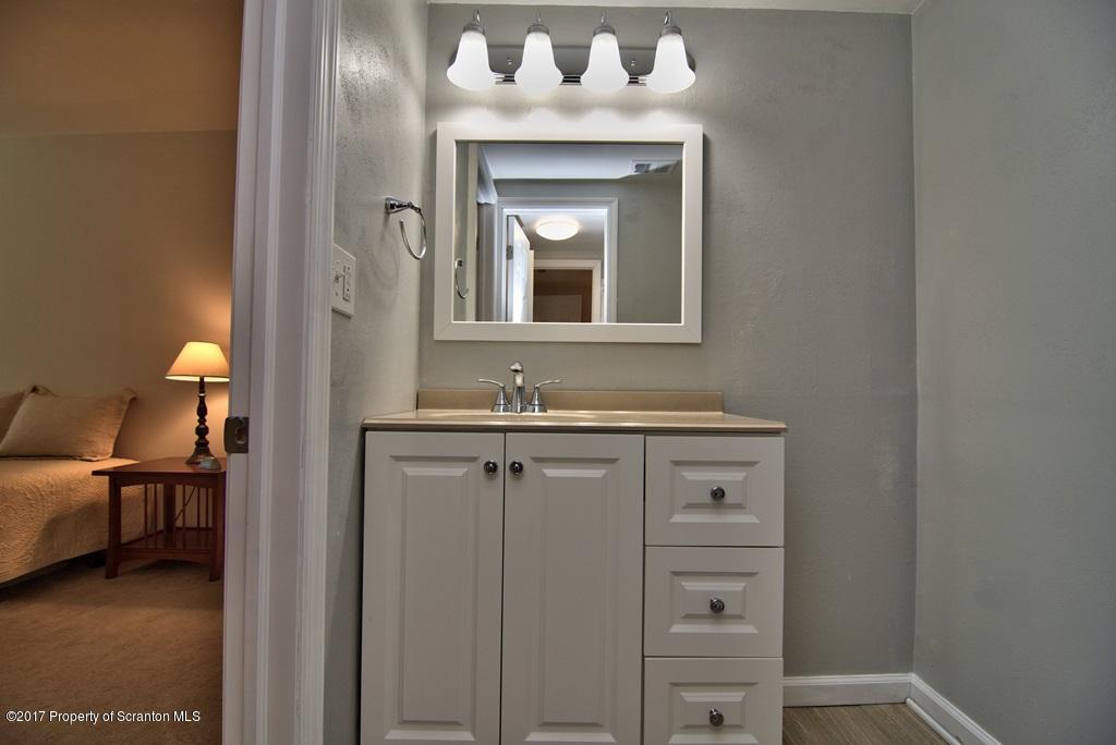 1211 Summit Pointe Scranton, PA 18508 - Photo 28 of 33 a close view of a sink and a mirror in a bathroom