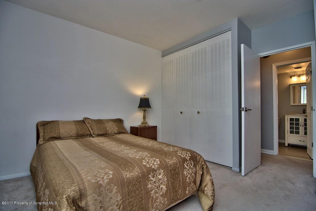 1211 Summit Pointe Scranton, PA 18508 - Photo 30 of 33 a bedroom with a bed and a night stand